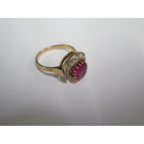 62 - A yellow gold ruby or spinel and diamond crescent ring the centre stone approx 9mm x 4.5mm - tests t... 