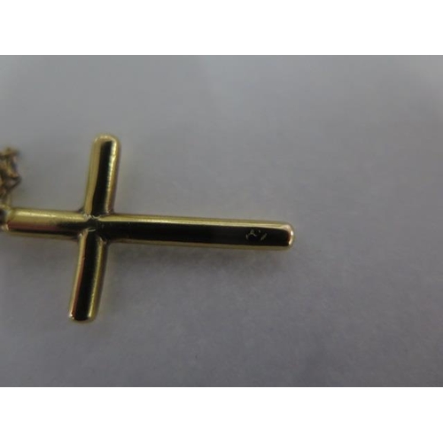 65 - A 18ct yellow gold crucifix on a 78cm no clasp chain - approx weight 7.7 grams - and a 9ct crucifix ... 