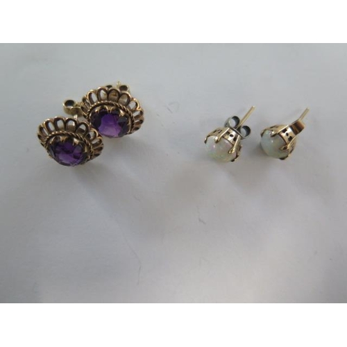 71 - A pair of 9ct yellow gold amethyst earrings 14mm wide, approx total weight 4.8 grams, generally good... 