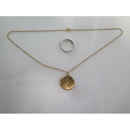 73 - A 9ct yellow gold chain approx weight 1.5 grams, a plated locket and a platinum band ring size Q, ap... 