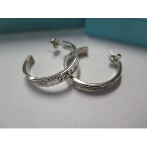 79 - A pair of Tiffany & Co silver hoop 1837 earrings - Width 28mm with pouch and box - retail price £455