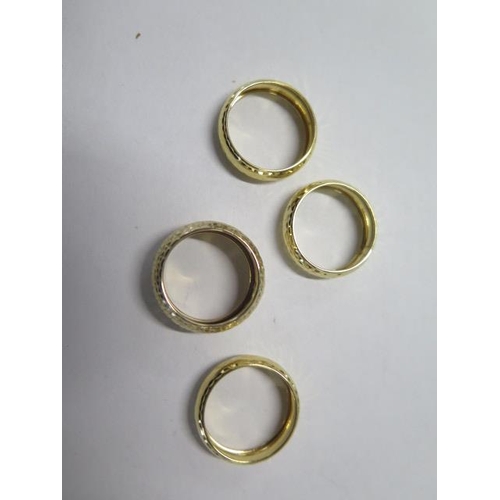 81 - Four 9ct gold band rings, sizes N,M and O - total approx weight 3.7 grams