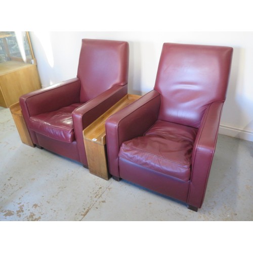 493 - *A pair of maroon leather  cinema armchairs with walnut veneer cupholder side tables - apparantly re... 