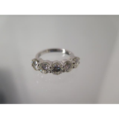 69 - A five stone diamond ring - approx 2.75ct of diamonds set in platinum - ring size M - head size appr... 