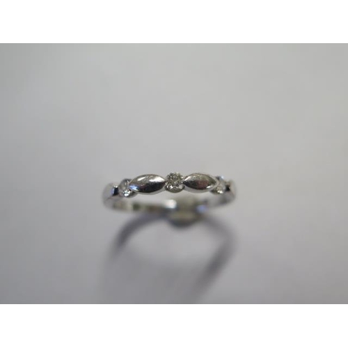 67 - A 9ct white gold diamond Forever ring with three diamonds - total weight 0.15ct, colour H, clarity S... 