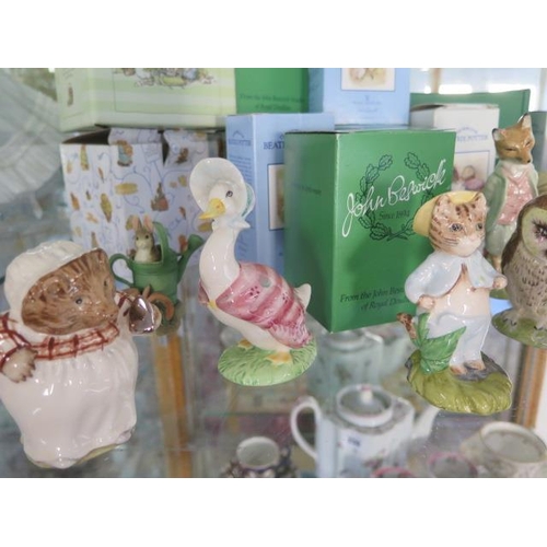 227 - A collection of Royal Doulton, Beswick, Royal Albert, FW&Co Beatrix Potter figures - mostly boxed, a... 