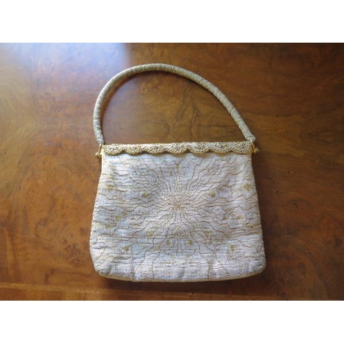 228 - A vintage Asprey silver and gilt material evening handbag, made in France - Width 20cm - some wear b... 