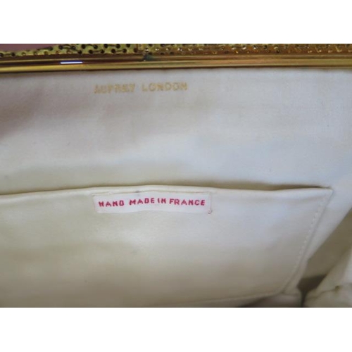 228 - A vintage Asprey silver and gilt material evening handbag, made in France - Width 20cm - some wear b... 