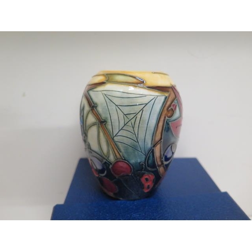 230 - A small Moorcroft 2002 butterfly vase - Height 9cm boxed with three Moorcroft Collectors Club newsle... 