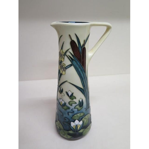 231 - A Moorcroft Lilley pad vase/jug - Height 24cm - in good condition , red dot for second