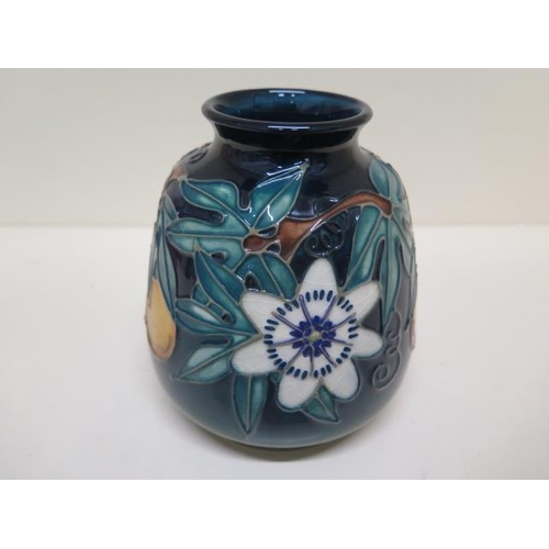 233A - A Moorcroft vase C97 - Height 14.5cm - some crazing to base otherwise good condition