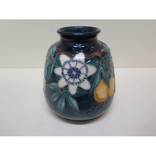 233A - A Moorcroft vase C97 - Height 14.5cm - some crazing to base otherwise good condition