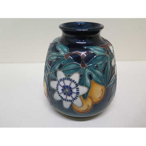 233A - A Moorcroft vase C97 - Height 14.5cm - some crazing to base otherwise good condition