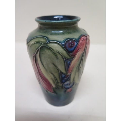 234A - A small Moorcroft vase - Height 10cm - some crazing to base but good condition