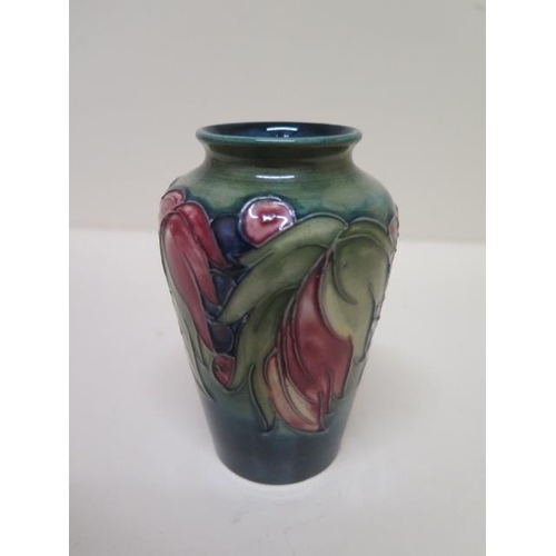 234A - A small Moorcroft vase - Height 10cm - some crazing to base but good condition