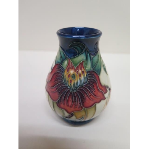 235 - A small Moorcroft vase - Height 10cm - in good condition