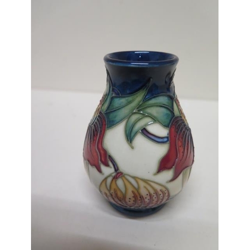 235 - A small Moorcroft vase - Height 10cm - in good condition