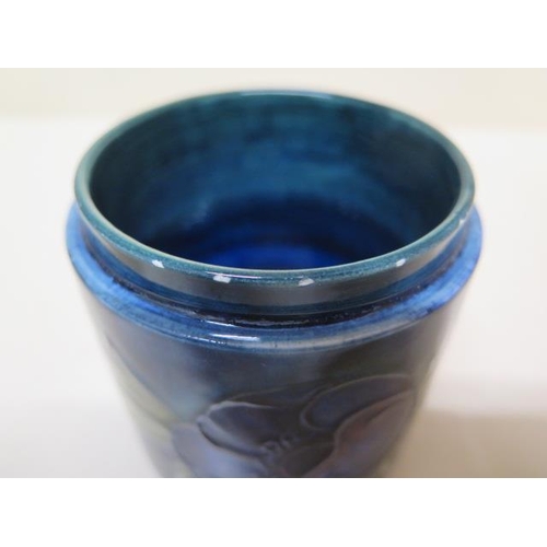 236A - A Moorcroft blue ground lidded pot - Height 8.5cm - some crazing mainly to base, small chips to insi... 