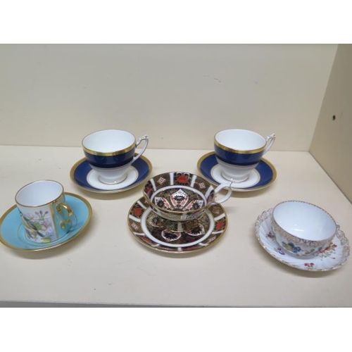 239 - A Crown Derby Imari 1128 cup and saucer, a Caverswall blue tit cup and saucer, a Dresdan cup and sau... 