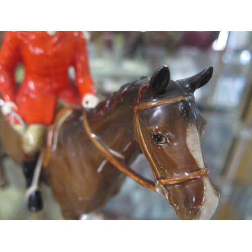 244 - A Beswick model of a lady side saddle on jumping horse 982- rings as if cracked - and a Beswick Hunt... 