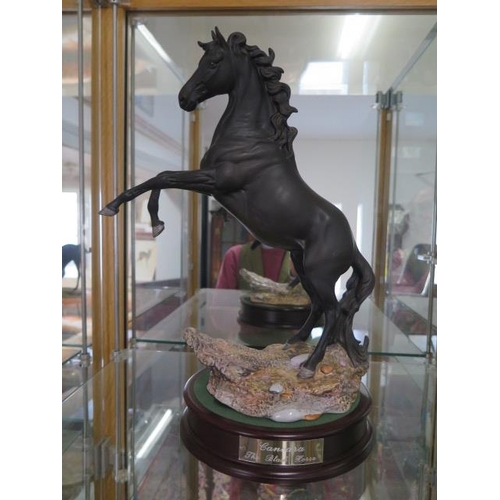 245 - A Royal Doulton rearing horse Cancara The Black Horse DA234 on a stand - Height 43cm tall - good con... 