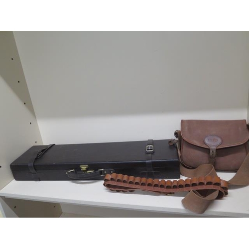 253 - A Gunmark leather shotgun case, a Brady cartridge bag and a cartridge belt