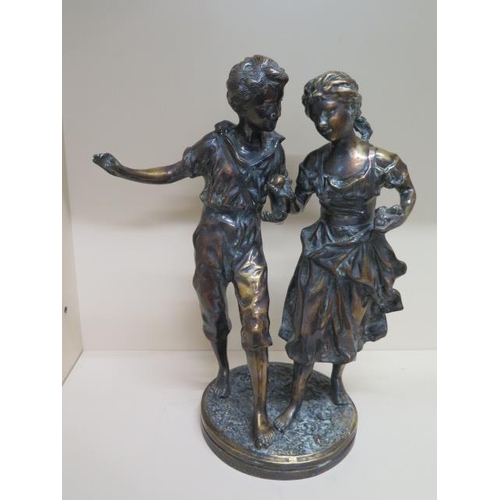 255 - A bronze group of a boy and girl the base stamped Moreau - Height 46cm