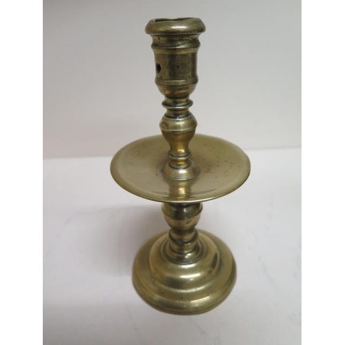 266 - An 18th century brass candlestick with drip tray - Height 20cm