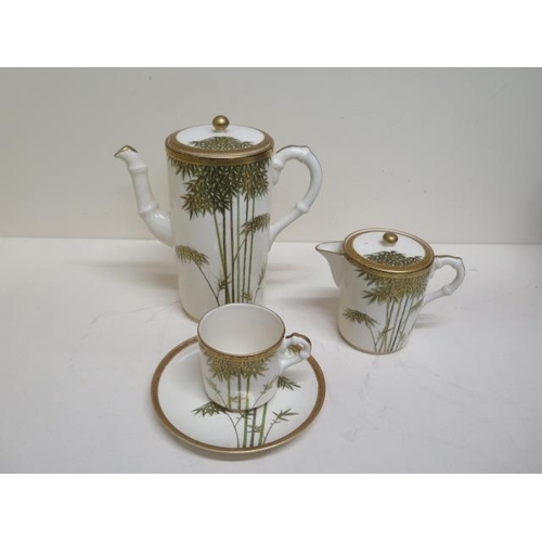 269 - A Satsuma coffee pot - 17cm tall - a lidded milk jug and a coffee can and saucer - minute chip to li... 