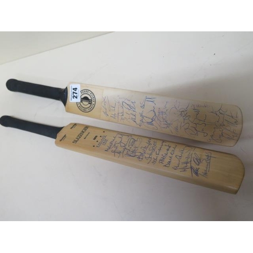 274 - Two autographed mini cricket bats signed by England, New Zealand and South Africa teams, the first s... 