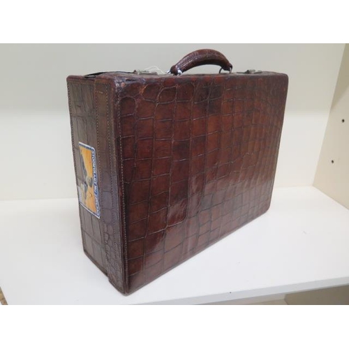 285 - An early 20th century crocodile travel suitcase - Width 45cm x 16cm x 35cm - wear consistent with ag... 