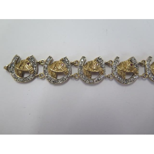 30 - A hallmarked 9ct yellow and white gold horse head and horseshoe bracelet - Length 20cm - approx weig... 