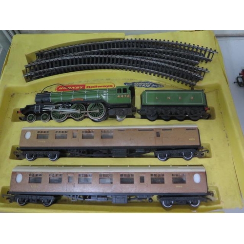 306 - Hornby OO Gauge part boxed Flying Scotsman set, two locos and three carriages