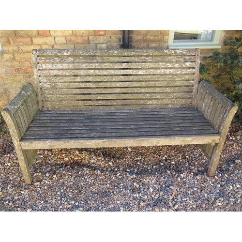 474 - A weathered teak garden bench - Width 160cm