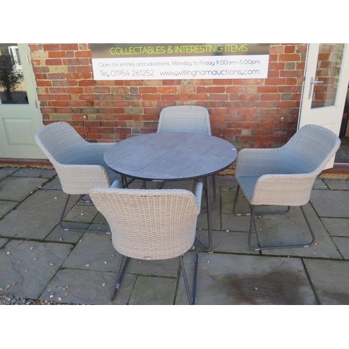 475 - A Bramblecrest garden table and four chairs - Diameter 110cm