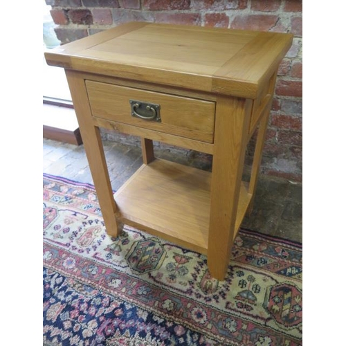 480 - An oak lamp table with a drawer - Height 78cm x 60cm x 44cm