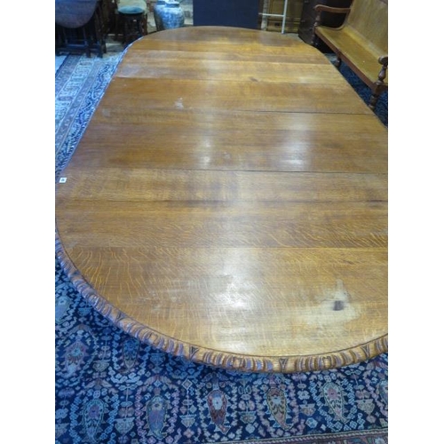 482 - A large oak dining D end table with an adapted later underframe standing on turned reeded legs with ... 