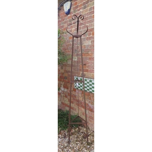 486 - A hand forged wrought iron triangular section garden obelisk with scroll finial - Height 231cm x Wid... 