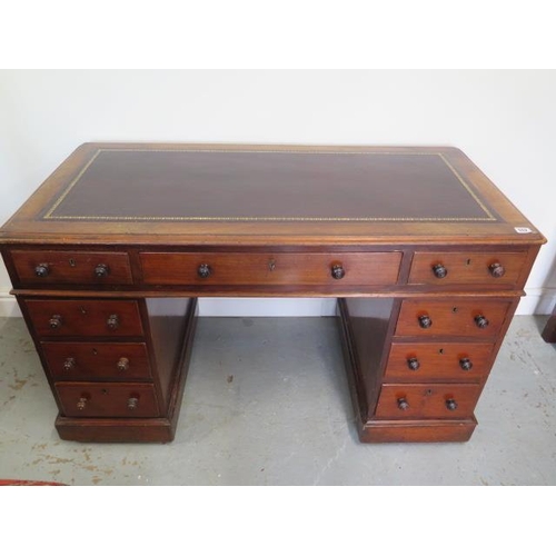 502 - A Victorian mahogany nine drawer twin pedestal desk with a leather inset top - Height 73cm 120 cm wi... 