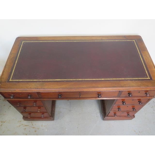 502 - A Victorian mahogany nine drawer twin pedestal desk with a leather inset top - Height 73cm 120 cm wi... 