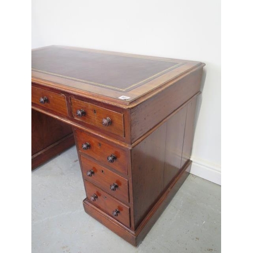 502 - A Victorian mahogany nine drawer twin pedestal desk with a leather inset top - Height 73cm 120 cm wi... 