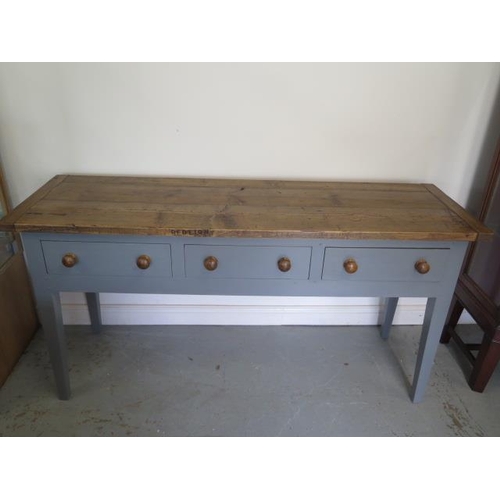 506 - A painted pine three drawer kitchen/studio serving work table with a waxed pine top - Height 86cm x ... 