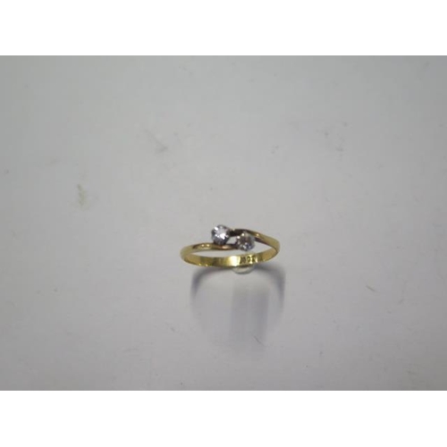 53 - An 18ct yellow gold diamond crossover ring size S - approx weight 2.4 grams - diamonds bright