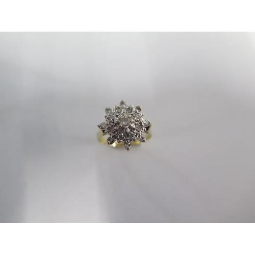 60 - A hallmarked 18ct yellow gold diamond cluster ring size N - approx weight 4.5 grams - diamonds brigh... 