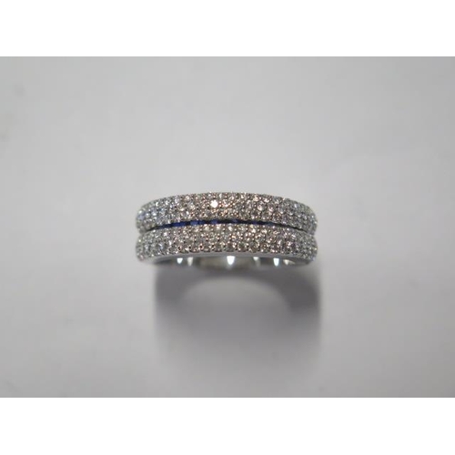 63 - An unusual 18ct white gold hinged diamond and sapphire ring approx 125 diamonds and 8 sapphires, rin... 