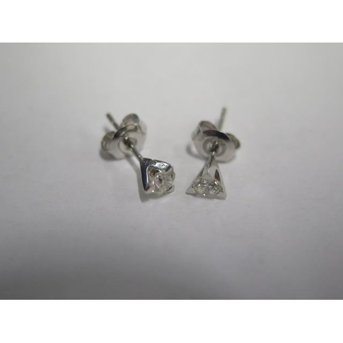 71 - A pair of 18ct white gold diamond stud earrings each approx 0.20ct - diamonds bright and lively