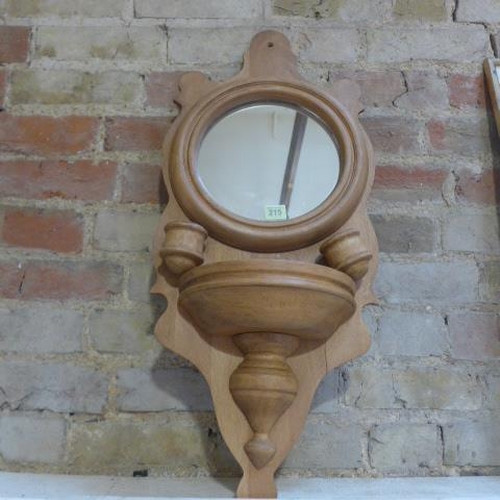 215 - A wall mirror - Height 77cm