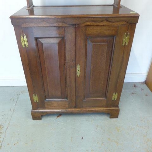 249 - An oak two door panelled cupboard with an open rack top, nice polished colour - Height 166cm x 77cm ... 