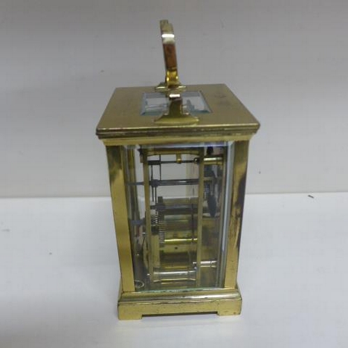 258 - A French carriage clock - Height 14cm with handle down - running, with key