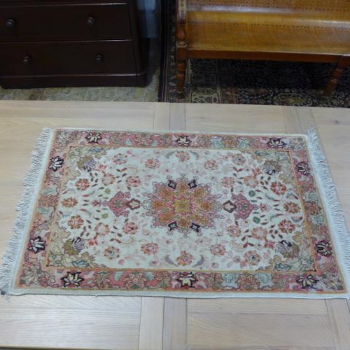 300 - A Tabriz rug in multi pastel colours - 100cm x 60cm